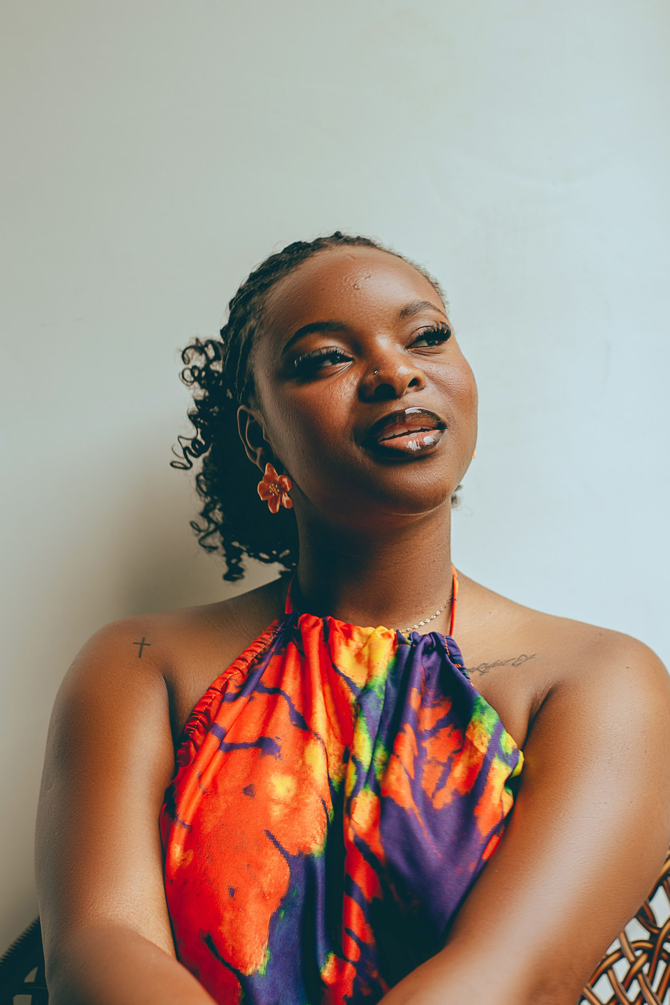 Editorial portrait of Ashley Charles, UGC creator, in a cream knit sweater with warm natural light