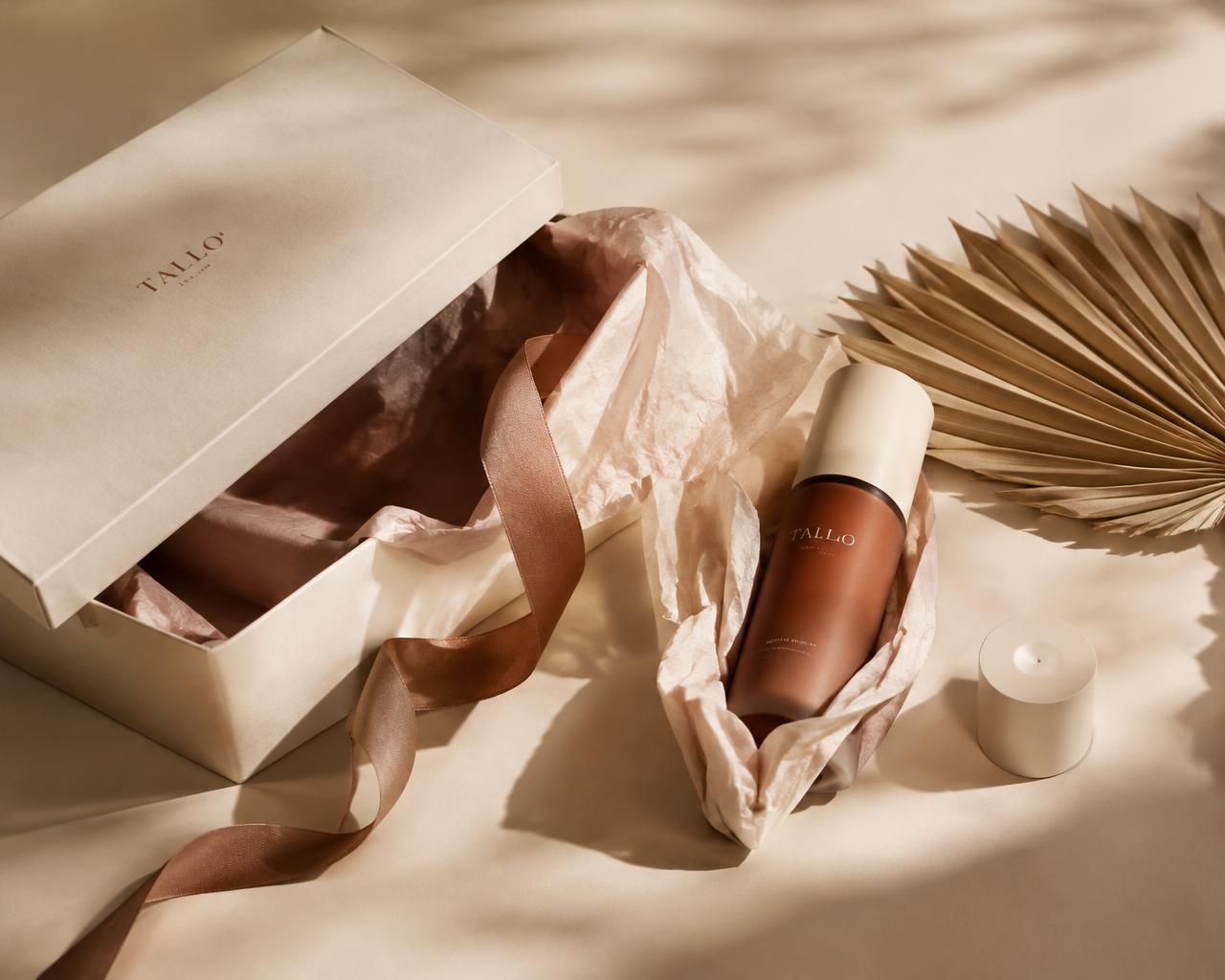 Elegant product unboxing styled with ribbon and dried palm leaf